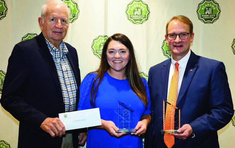 RECEIVES AWARD - The Barbour County Farm-City Committee received the Target Award and Best Farm-City Tour for Division II during the Alabama Farm-City Awards Program April 11 in Auburn. For each recognition, the committee earned a cash award from the Alabama Farmers Agriculture Foundation (AFAF). Division II is for counties with smaller populations. From left are AFAF Board Member Mahlon Richburg, Barbour County Farm-City Committee Member Shelby Easterling, and Alabama Farm-City Committee Chair Jeff Helms of the Alabama Farmers Federation.