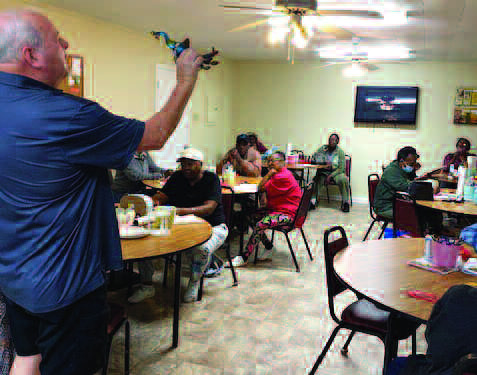 PENNY AUCTION - Bill Elkins is shown auctioning items at the Clayton Senior Center’s Penny Auction held recently. Participants were enthusiastic as they bid on the donated items, hoping to win the items of their choice. Anyone who wishes to donate items for events at the Clayton Senior Center or to volunteer may contact the director, Kim Singleton, at 334-621-5004. Items also may be left at the center located at 51 North Midway Street in Clayton. Participants also encourage everyone to attend their May Day Festival to be held on the grounds of the Octagon House on May 3 from 8 a.m. until 2 p.m. Hot dogs, popcorn, a lemonade stand will be available and jewelry, plants and crafts will be available for purchase. Any donations will be appreciated. Admission is free!